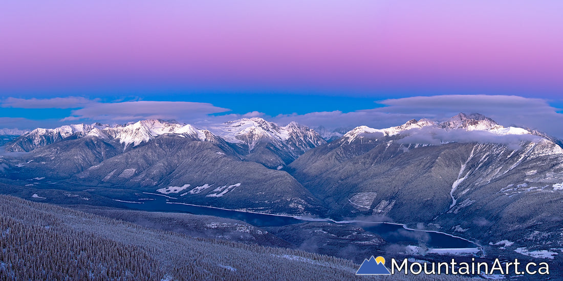 Alpenglow over rugged BC Purcell mountains Winter panorama