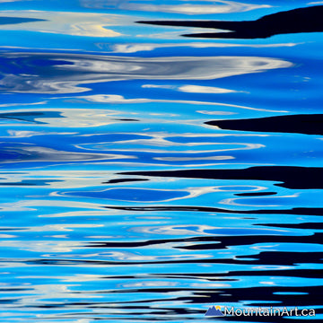 Glassy Kootenay Lake reflections of sky and mountains abstract art