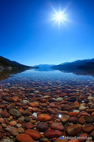 Pebble Beach with sunstar on the East Shore of Kootenay Lake, BC