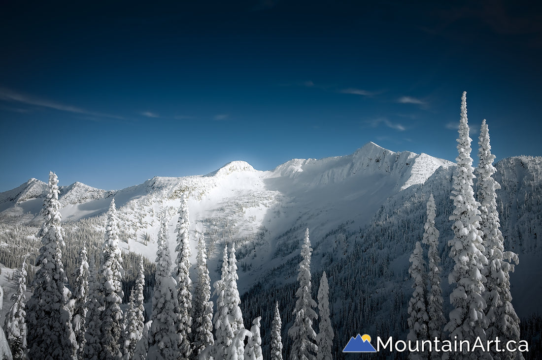 Whitewater backcountry snow covered Ymir Bowl and Ymir Peak